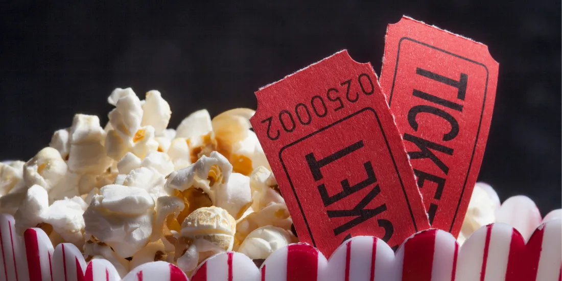 Popcorn with two movie tickets