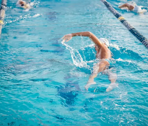 Kids swimming in swimming lane