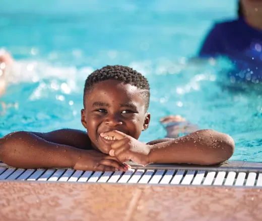 Boy smiling in pool