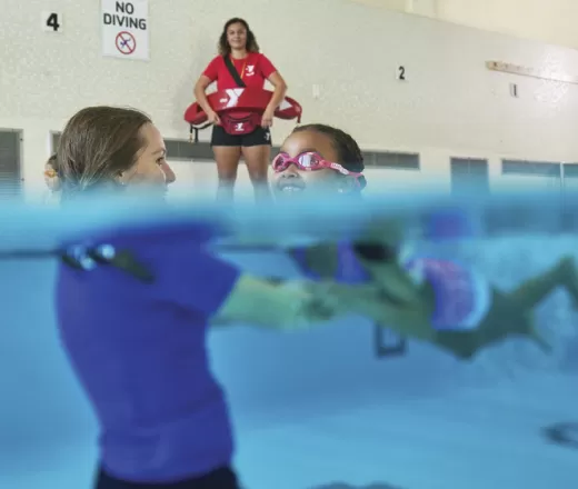 girl learning how to swim