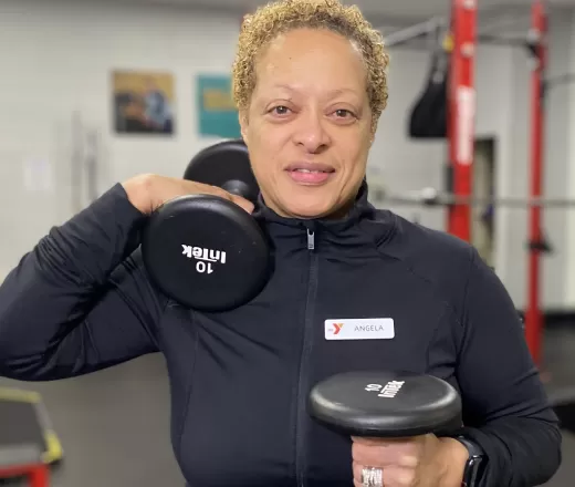 Woman headshot holding weights