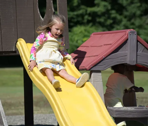 girl going down slide