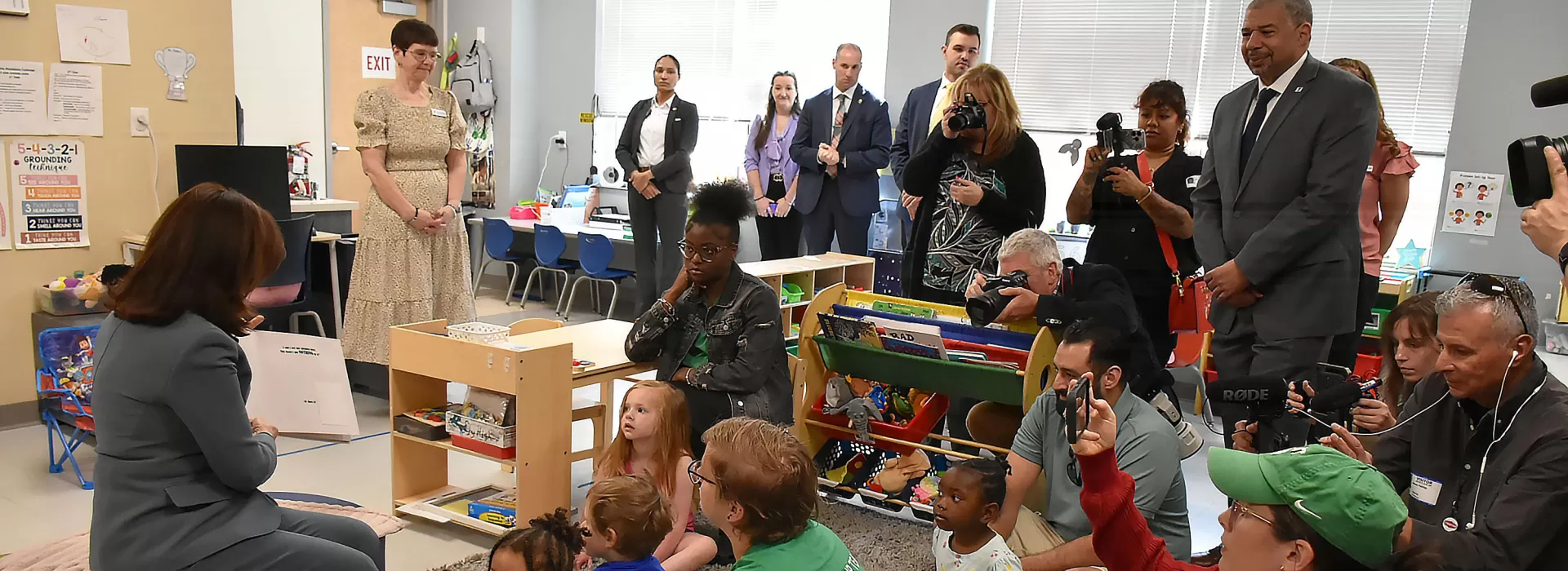 Governor in classroom reading to kids