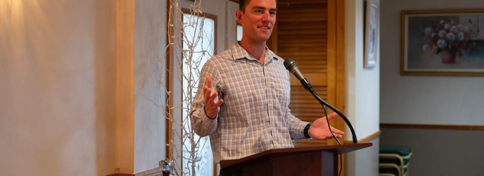 Man speaks at podium