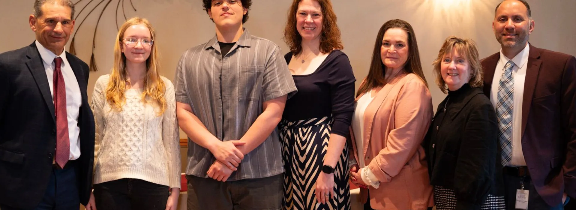 Group of individuals pose for a photo